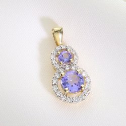 Złota zawieszka z tanzanitami i brylantami – elegancja i blask