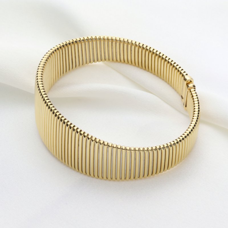 Elegancka Złota Bransoleta Sprężynowa - Klasyka w Nowoczesnym Wydaniu