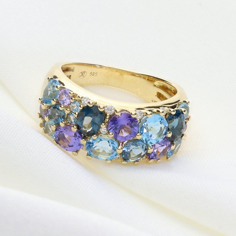 Ekskluzywny złoty pierścionek z tanzanitem, topazami i brylantami