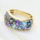 Ekskluzywny złoty pierścionek z tanzanitem, topazami i brylantami