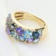 Ekskluzywny złoty pierścionek z tanzanitem, topazami i brylantami