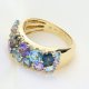 Ekskluzywny złoty pierścionek z tanzanitem, topazami i brylantami