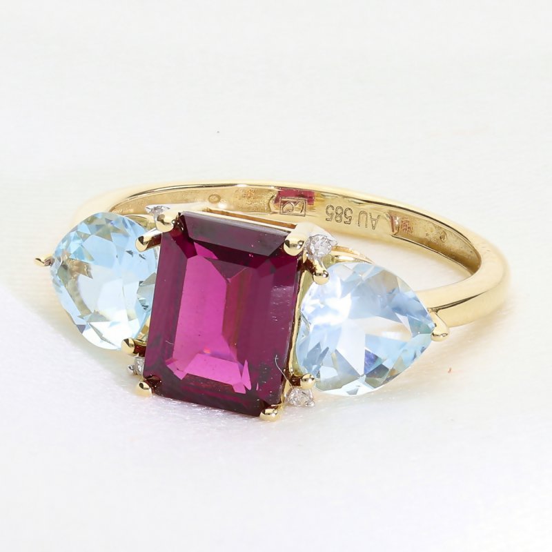 Ekskluzywny złoty pierścionek z rodolitem, topazami i brylantami